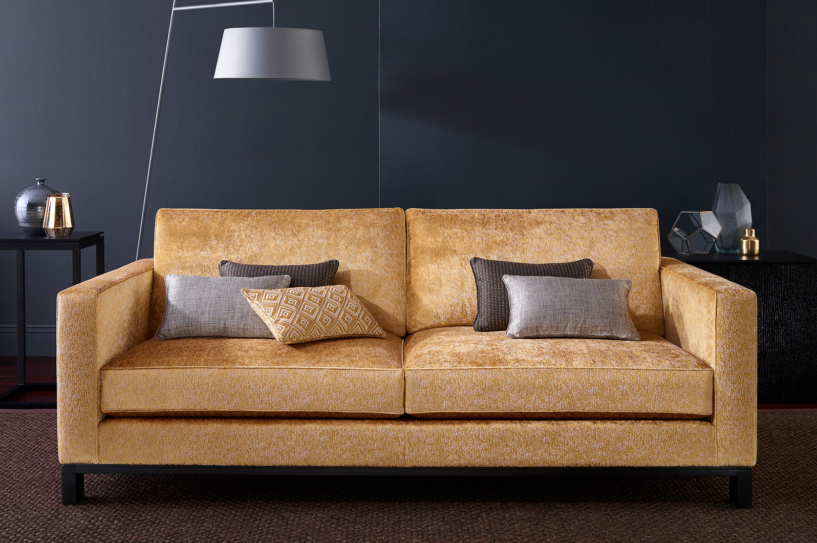Studio set shot designed and lit to emphasize the geometric nature of the sofa design.