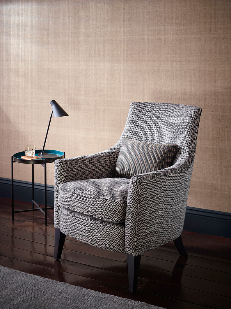 Studio set shot lit to highlight the curved shape of the chair.