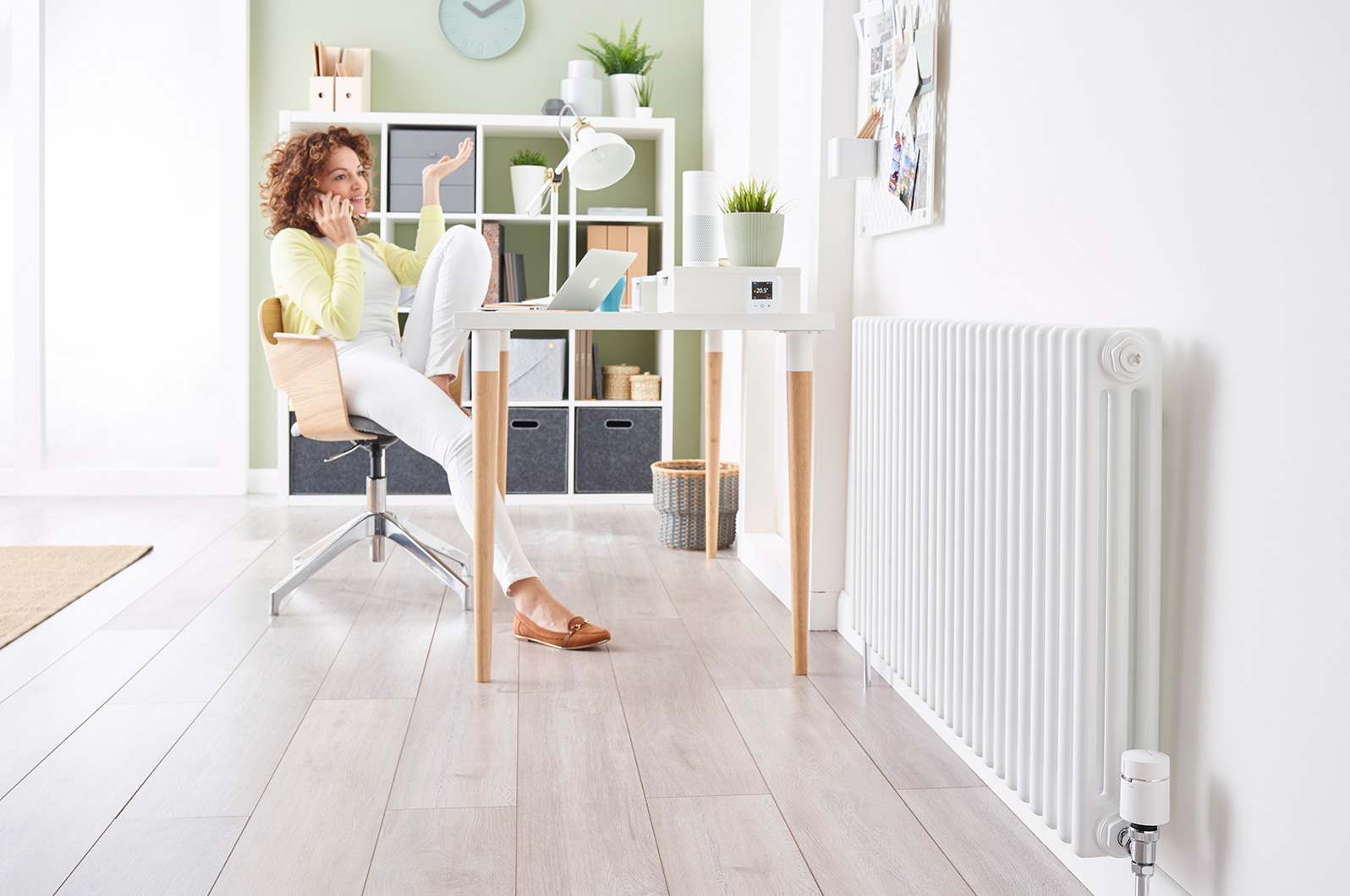 Studio image to show the radiator valve within a room setting.