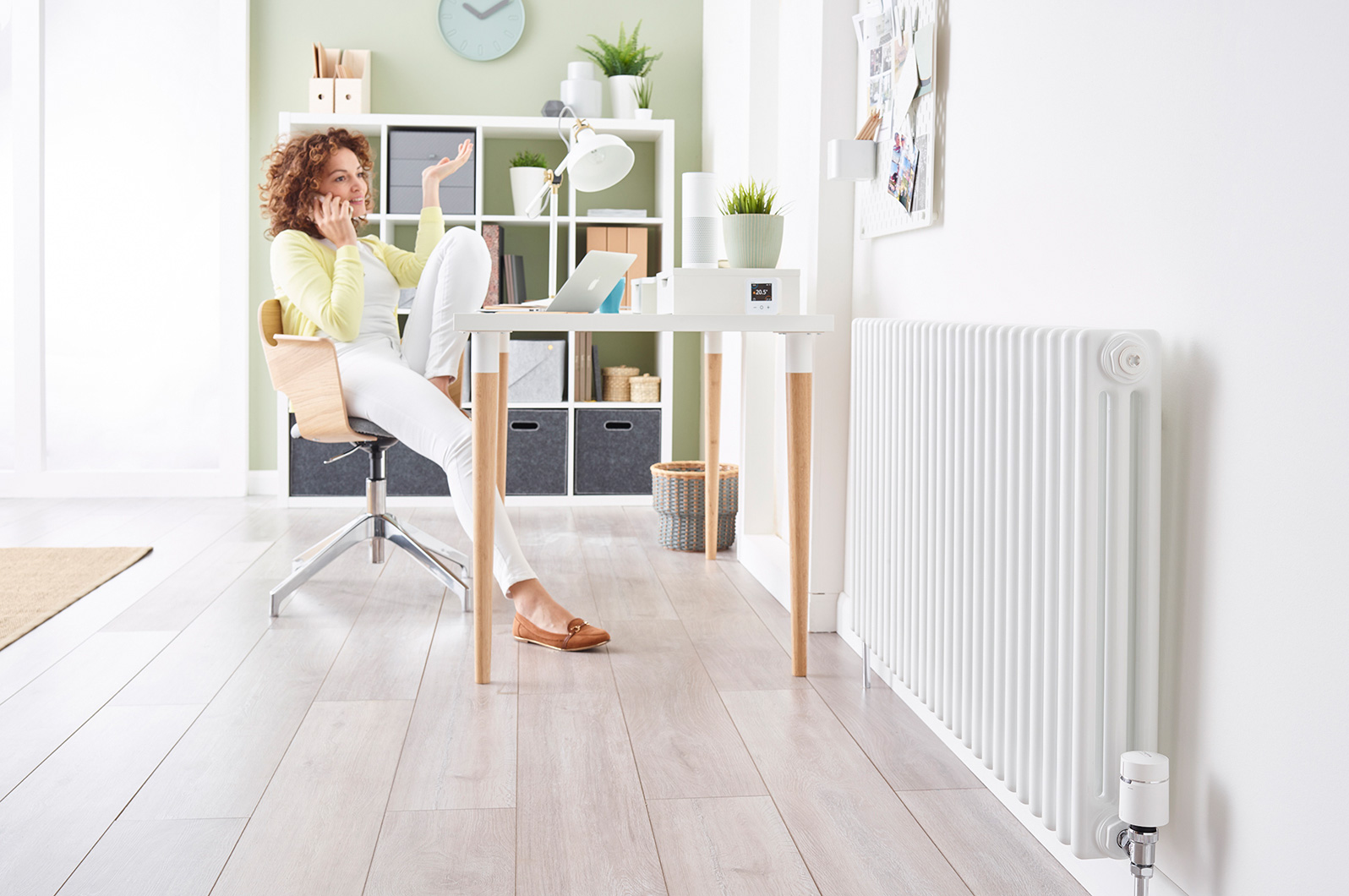 Studio image to show the radiator valve within a room setting.